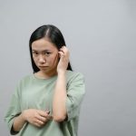 woman feeling very shy, timid, and insecure about herself